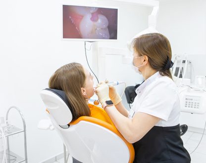 dentist examine girl teeth
