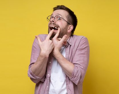Guy is showing gaps between teeth's
